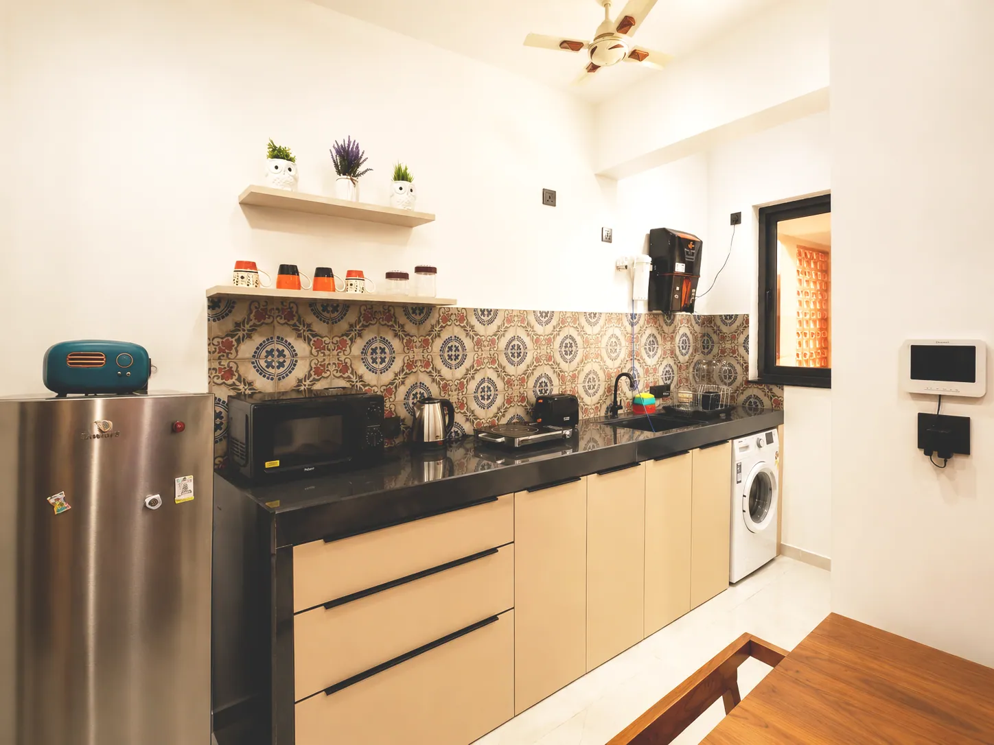 Equipped apartment kitchen with refrigerator, cooktop, microwave, water purifier and washing machine
